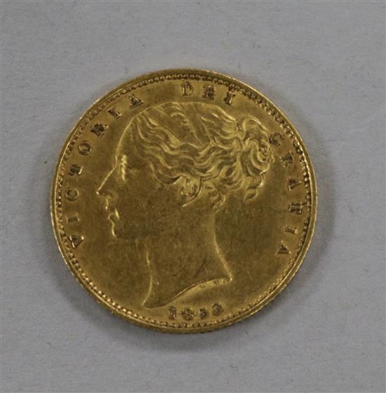 An 1853 gold full sovereign.